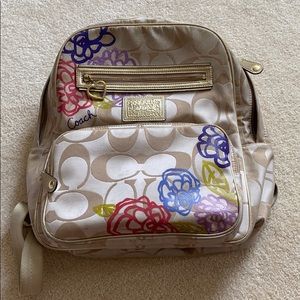 Coach gold colored backpack